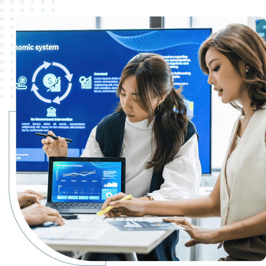 Business team discussing data with laptop presentation.